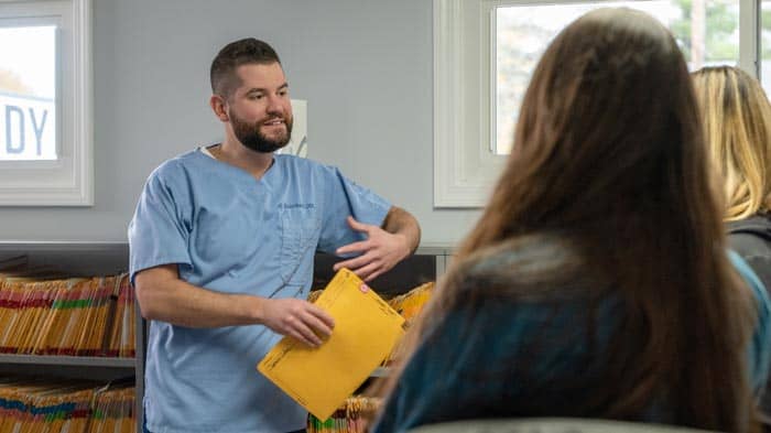 Dr. Bandy talking with a patient | Bandy Dental in Holly, MIi